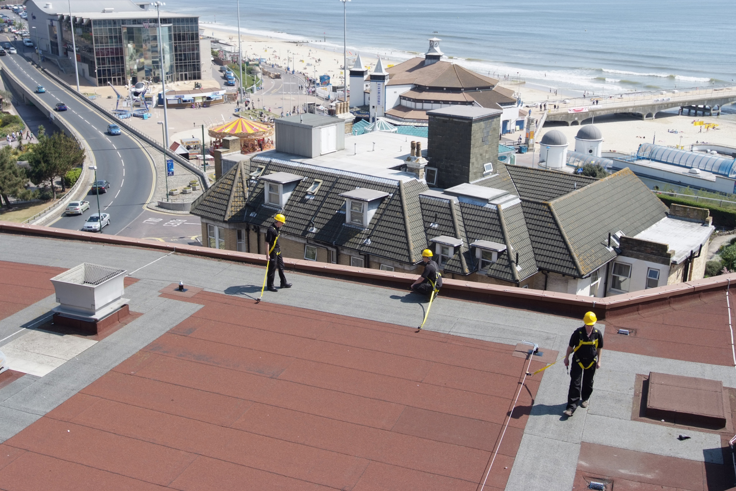 Roofers in Safety Harnesses